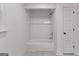 Bathroom featuring a classic white tub and shower, complemented by white tile surround at 8129 S Giles Rd, Douglasville, GA 30135
