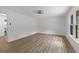 Spacious bedroom featuring modern flooring and a large window for natural light at 8129 S Giles Rd, Douglasville, GA 30135