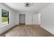 Bedroom featuring a closet and ample natural light, with modern vinyl flooring at 8129 S Giles Rd, Douglasville, GA 30135