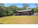 Charming black home featuring a covered front porch at 8129 S Giles Rd, Douglasville, GA 30135