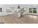 Bright and airy kitchen features an island with seating, modern lighting, and lots of counter space at 8129 S Giles Rd, Douglasville, GA 30135