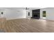 Bright living room with hardwood floors, a black brick fireplace, and access to the outdoors at 8129 S Giles Rd, Douglasville, GA 30135