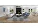 Bright living room with modern furnishings, a fireplace, and access to the outdoors at 8129 S Giles Rd, Douglasville, GA 30135