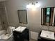 Bathroom showcasing double vessel sinks, modern fixtures, and tile accents at 5147 Roswell Rd # 47, Atlanta, GA 30342