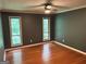 Bedroom with hardwood floors, neutral paint, and ceiling fan at 5147 Roswell Rd # 47, Atlanta, GA 30342