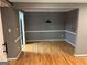 Open dining room area features hardwood floors and neutral paint at 5147 Roswell Rd # 47, Atlanta, GA 30342