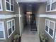 Building exterior featuring stairs leading to the units and well-maintained landscaping at 5147 Roswell Rd # 47, Atlanta, GA 30342