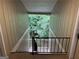 Exterior of units in a building with a view of trees and a black railing at 5147 Roswell Rd # 47, Atlanta, GA 30342