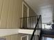 Exterior hallway providing access to units, with railing and well-kept building facade at 5147 Roswell Rd # 47, Atlanta, GA 30342