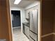 Updated kitchen boasts stainless steel appliances and stone tile floors at 5147 Roswell Rd # 47, Atlanta, GA 30342