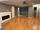Open-concept living room showcasing hardwood floors, a fireplace, and ample space for entertaining at 5147 Roswell Rd # 47, Atlanta, GA 30342