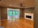 Spacious living room with hardwood floors, a modern fireplace, and ample natural light at 5147 Roswell Rd # 47, Atlanta, GA 30342