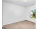 Well-lit bedroom featuring neutral carpet and a window with backyard views at 3692 Wartrace Dr, South Fulton, GA 30331