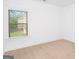 Bright bedroom with a large window and view of backyard and trees at 3692 Wartrace Dr, South Fulton, GA 30331