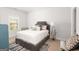 Nicely appointed bedroom features plush carpets and a luxurious bed with throw pillows at 3692 Wartrace Dr, South Fulton, GA 30331