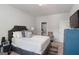 This bedroom features a leather bed, plush bedding, and a connected bath at 3692 Wartrace Dr, South Fulton, GA 30331