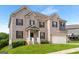 Charming two-story brick home with well-manicured lawn and a welcoming front porch at 3692 Wartrace Dr, South Fulton, GA 30331