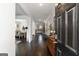 Elegant foyer featuring dark hardwood floors and views of the dining room and kitchen, offering a seamless flow at 3692 Wartrace Dr, South Fulton, GA 30331