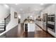 Modern kitchen with stainless steel appliances and dark hardwood floors is designed for functionality at 3692 Wartrace Dr, South Fulton, GA 30331