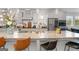 Spacious kitchen island with granite countertops, bar stool seating, and stainless steel appliances, perfect for gathering at 3692 Wartrace Dr, South Fulton, GA 30331