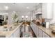 Modern kitchen showcasing granite countertops, stainless steel appliances, and ample storage, open to other living areas at 3692 Wartrace Dr, South Fulton, GA 30331