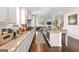 Bright eat-in kitchen boasts granite counters, white cabinetry, and stainless steel appliances at 3692 Wartrace Dr, South Fulton, GA 30331