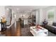 Spacious living room flows into the kitchen, featuring hardwood floors and an open layout at 3692 Wartrace Dr, South Fulton, GA 30331