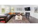 Spacious living room with a fireplace and oversized leather sofa provides a comfortable gathering space at 3692 Wartrace Dr, South Fulton, GA 30331
