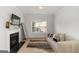 Bright living room with a fireplace, neutral color palette and large picture window at 3692 Wartrace Dr, South Fulton, GA 30331