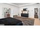 Spacious main bedroom featuring neutral decor, tray ceilings and decorative furnishings at 3692 Wartrace Dr, South Fulton, GA 30331