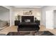 Spacious main bedroom featuring tray ceilings, large window and dark toned furniture at 3692 Wartrace Dr, South Fulton, GA 30331