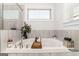 Bathroom featuring a soaking tub with tiled surround and decor at 3692 Wartrace Dr, South Fulton, GA 30331