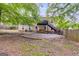 Spacious backyard featuring a patio, hot tub, deck with stairs, and mature trees at 129 Onyx Ct, Carrollton, GA 30116