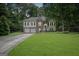 Charming two-story home with a well-manicured lawn and a two-car garage at 129 Onyx Ct, Carrollton, GA 30116