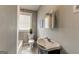 Clean bathroom featuring grey walls and a classic sink and toilet at 1091 Selwin Sw Ave, Atlanta, GA 30310
