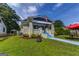 Charming home boasts a covered front porch, brick accents, and a vibrant blue pathway at 1091 Selwin Sw Ave, Atlanta, GA 30310