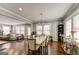 Spacious living and dining area with hardwood floors, modern lighting, and neutral wall colors at 1091 Selwin Sw Ave, Atlanta, GA 30310