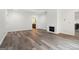 Bright and airy bedroom with hardwood flooring, fireplace, and plenty of natural light from windows and door at 4186 Matisse Ln, Fairburn, GA 30213