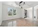 Elegant dining room with stylish lighting, tiled floors, and views of the landscaped yard at 4186 Matisse Ln, Fairburn, GA 30213