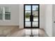Bright foyer with large windows and sleek tiled flooring provides a modern and inviting entrance at 4186 Matisse Ln, Fairburn, GA 30213