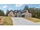 Stunning two-story brick home featuring a spacious driveway, attached garage, and professionally landscaped yard at 4186 Matisse Ln, Fairburn, GA 30213