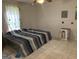 Bedroom with tile flooring, a ceiling fan and a single window at 6570 Laurens Way, Stone Mountain, GA 30087