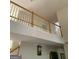 Open foyer with railing, wood trim, and stairway leading up to the second level at 6570 Laurens Way, Stone Mountain, GA 30087