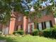 Charming brick two-story home with black shutters, front lawn, and front entrance at 6570 Laurens Way, Stone Mountain, GA 30087