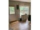 Eat-in kitchen with access to the backyard and updated vinyl floors at 6570 Laurens Way, Stone Mountain, GA 30087