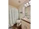 Traditional bathroom featuring a shower, toilet, and vanity at 150 Willow Shoals Dr, Covington, GA 30016