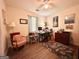 Bedroom featuring a ceiling fan, wood floors, and room for a home office at 150 Willow Shoals Dr, Covington, GA 30016