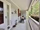 Cozy covered porch featuring rocking chairs and seasonal decorations for a welcoming entrance at 150 Willow Shoals Dr, Covington, GA 30016