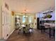 Eat-in kitchen showcases wood floors, stainless steel refrigerator, and view to the dining space at 150 Willow Shoals Dr, Covington, GA 30016