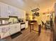 Kitchen showcases wood floors, white cabinets, modern hardware, and stainless steel refrigerator at 150 Willow Shoals Dr, Covington, GA 30016